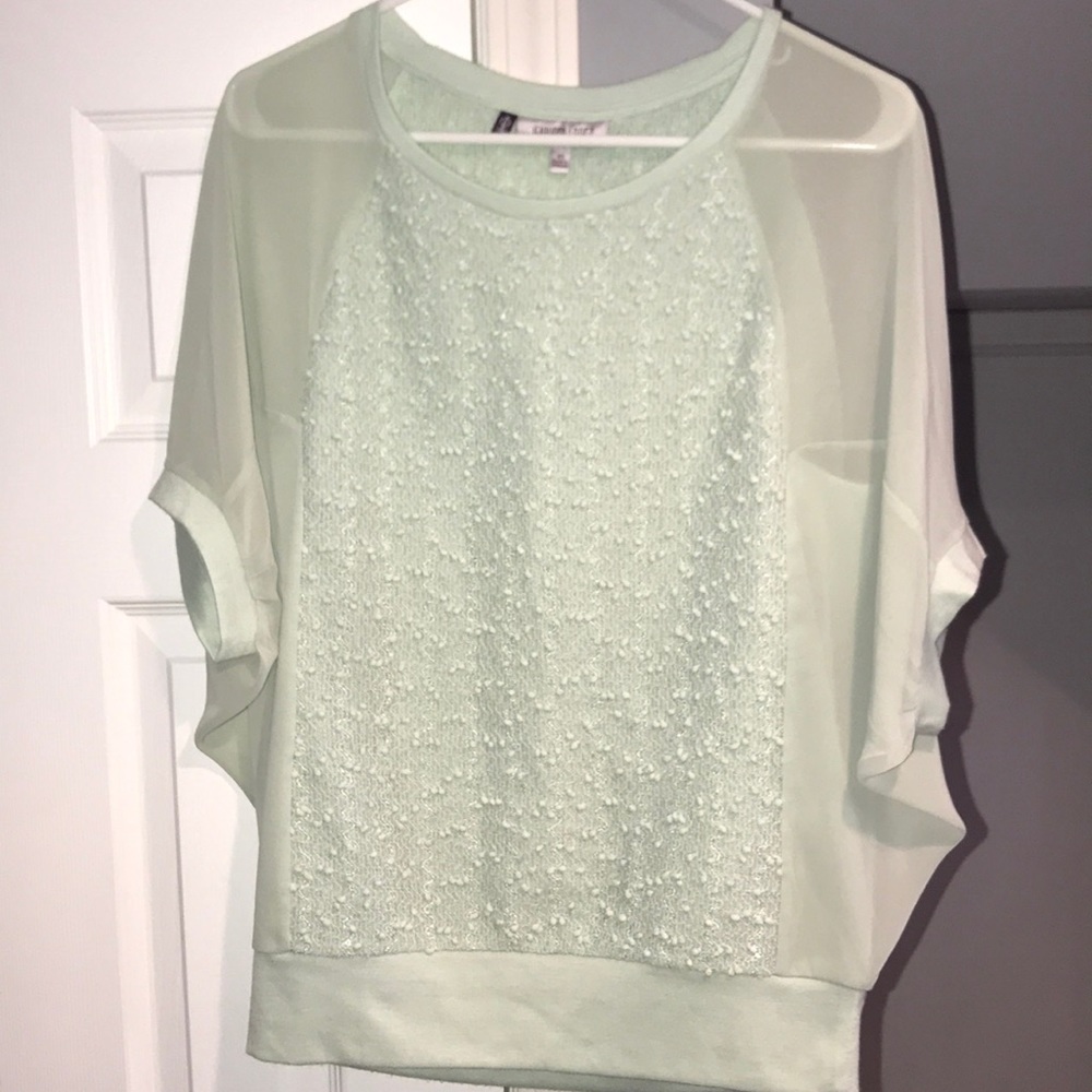 Dressy Jennifer Lopez batwing sleeve shirt.